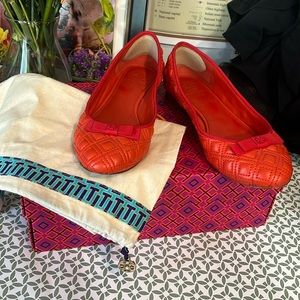 Tory Burch orange flats, with bag and dust bag .
